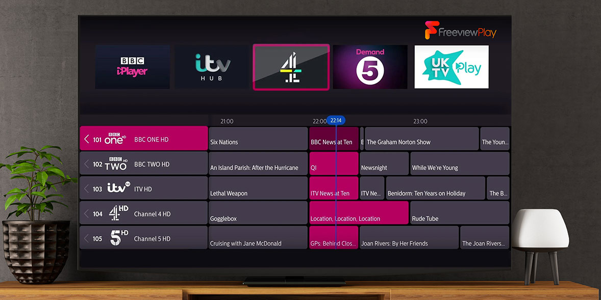 TV showing its EPG, the Freeview Play logo and several streaming app icons