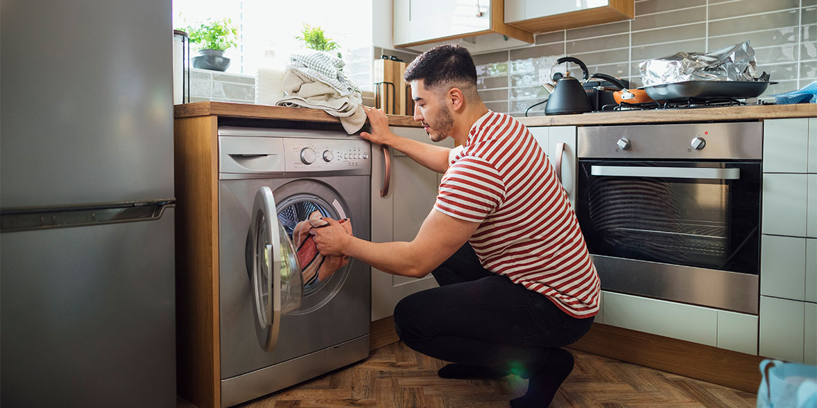Person unloading washing machine