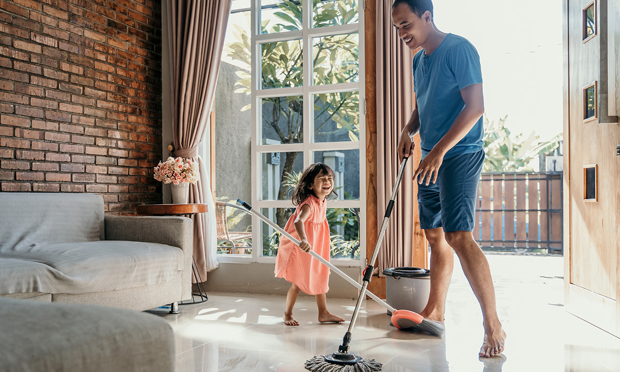 a man and girl enjoying spring cleaning