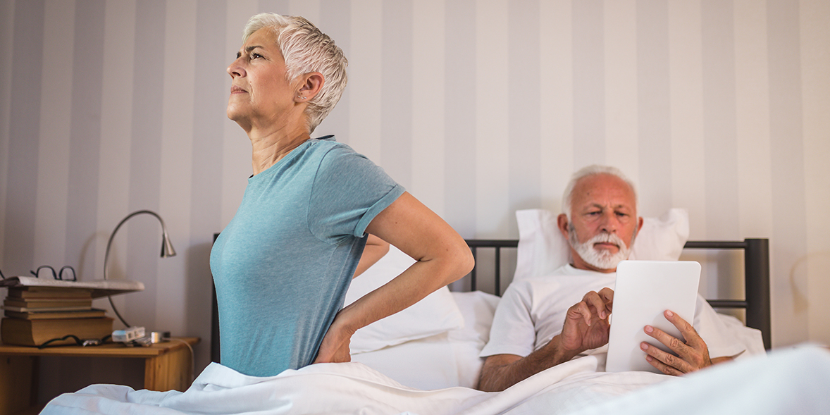 Woman having problem with her back due to uncomfortable mattress