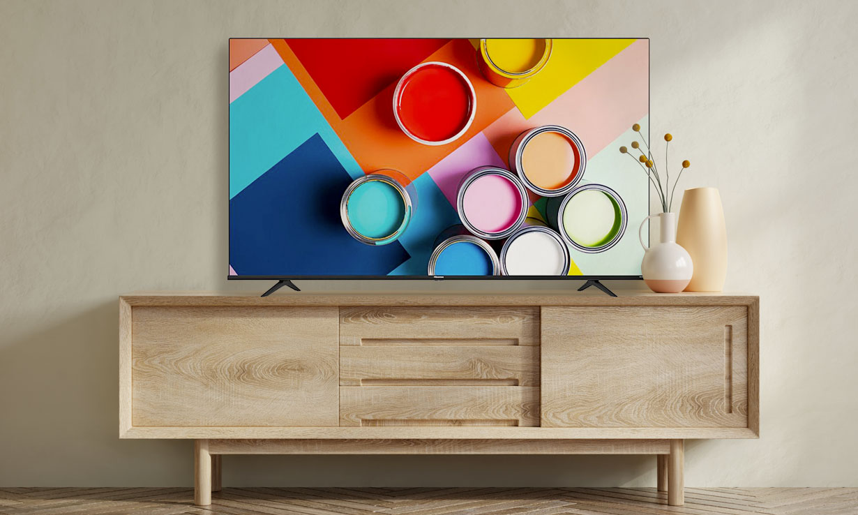 Hisense 55A6GTUK on a wood media unit