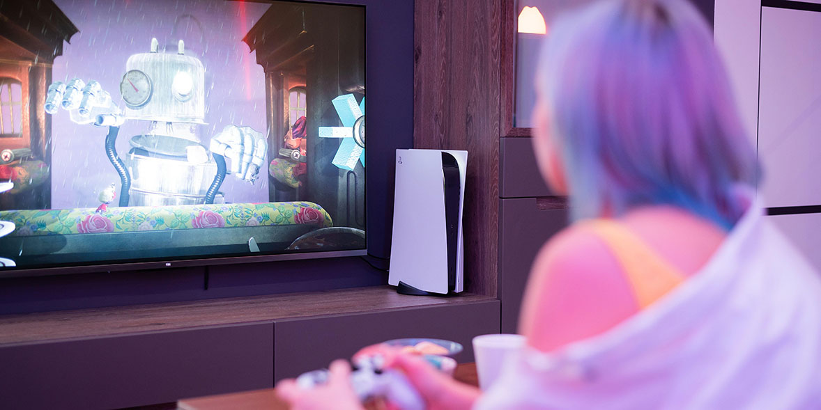Woman playing PlayStation 5